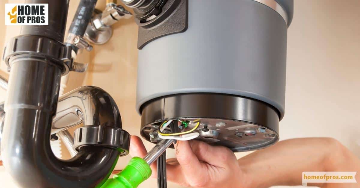Using an Allen wrench to rotate the disposal's flywheel