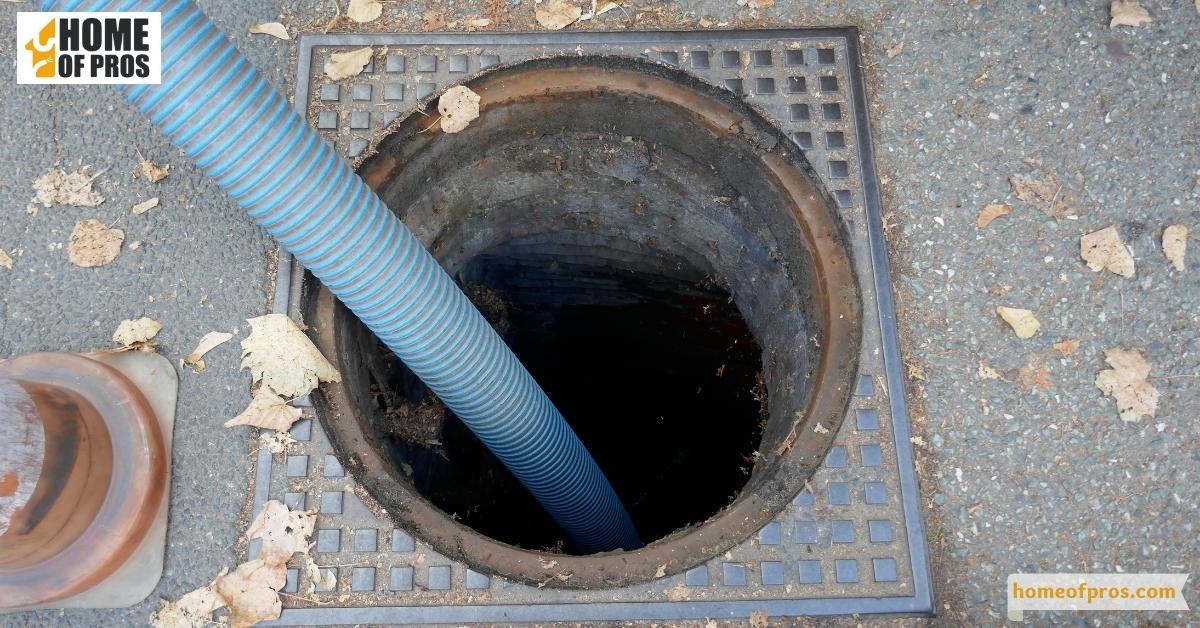Drain the tank using a garden hose